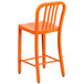 An orange Flash Furniture metal counter height stool with a vertical slat back.