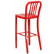 A Flash Furniture red metal bar stool with a backrest.