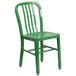 A green metal chair with a vertical slat back on a white background.