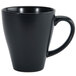 A close-up of a black Oneida Urban porcelain coffee mug with a handle.