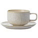 A white Oneida Knit porcelain coffee cup with a tan rim and saucer.