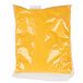 A yellow plastic bag of Gehl's Sharp Cheddar Cheese Sauce with a white background.