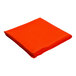 An orange Intedge square cloth table cover folded up