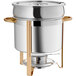 A Choice stainless steel Marmite soup chafer with gold accents.
