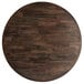 A Lancaster Table & Seating round wooden table top with espresso finish.