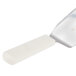 A white spatula with a white handle.