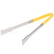 A pair of Vollrath tongs with a yellow handle.