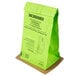 An Oreck green paper vacuum bag with black text.