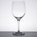 A clear Stolzle all-purpose wine glass on a table.