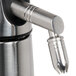 A close-up of a stainless steel iSi Nozzle Adapter.