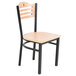 A Lancaster Table & Seating bistro chair with a natural wood seat and back and black frame.