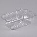 A clear plastic dish with a scalloped edge.