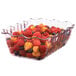 A clear Cambro Deli Crock filled with fruit.