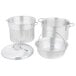 A Vollrath Wear-Ever pasta cooker set with a silver pot, lid, and colander.