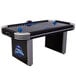 A black and silver Triumph Lumen-X Lazer air hockey table with blue lights on a table.