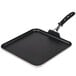A square black Vollrath griddle with a silver interior and black TriVent handle.