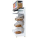 A white shelving unit with candy and dry food dispensers.