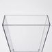 A clear square plastic tasting glass.