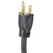 A close-up of a black plug with gold and black cords.