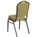 A green Flash Furniture banquet chair with a gold vein metal frame.