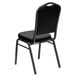 A Flash Furniture black vinyl banquet chair with a silver vein metal frame.