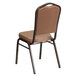 A Flash Furniture Hercules banquet chair with a brown fabric cushion.