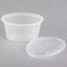 A Newspring clear oval plastic souffle container with a clear lid.
