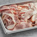 A tray of Hatfield Bacon Ends on a gray surface.