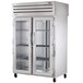 A True stainless steel pass-through heated holding cabinet with glass doors on both sides.