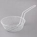 A white wire breading basket with a handle.