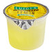A yellow container of Luigi's lemon Italian ice with a yellow substance in it.