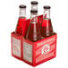 A group of Boylan Bottling Co. Shirley Temple soda bottles in a red box.
