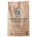 A brown bag of King Arthur Flour Baker's Classic organic bread flour with blue text.