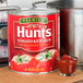 A can of Hunt's tomato ketchup on a counter.