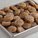 A tray of David's Cookies Classic Ginger Molasses cookies with white sugar crystals on top.
