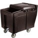 A brown plastic Cambro mobile ice bin with wheels and a sliding lid.