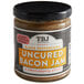 A jar of TBJ Gourmet Black Peppercorn Uncured Bacon Jam with a label.