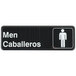A black and white Tablecraft sign with the words "Men" and "Caballeros" above a person.