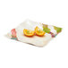 A white GET Contemporary melamine square plate with food on it.