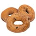 A group of Original New York Style Cinnamon Raisin Bagels with holes in them.