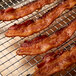 Kunzler bacon strips on a cooling rack.