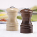 A close-up of a wooden salt and pepper shakers set.