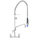 A Fisher pre-rinse faucet with a blue handle and chrome finish.