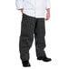 A person wearing Chef Revival black and white pinstripe chef pants.
