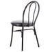 A Lancaster Table & Seating black metal hairpin chair with a black vinyl seat.