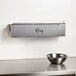 A stainless steel Choice film and foil dispenser on a counter.