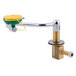 A T&S counter mounted eyewash unit with a green handle.