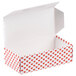 A white 1/2 lb. Valentine's Day heart candy box with red hearts on it.