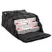 A black ServIt insulated pizza delivery bag holding three white pizza boxes.