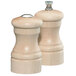 A close-up of a Chef Specialties maple salt and pepper shaker set with silver tops.